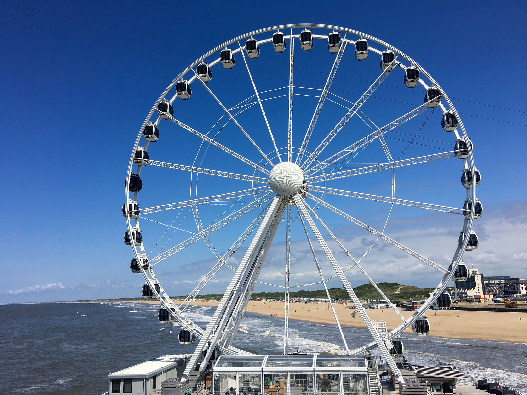 netherlands ferris wheel beach sun